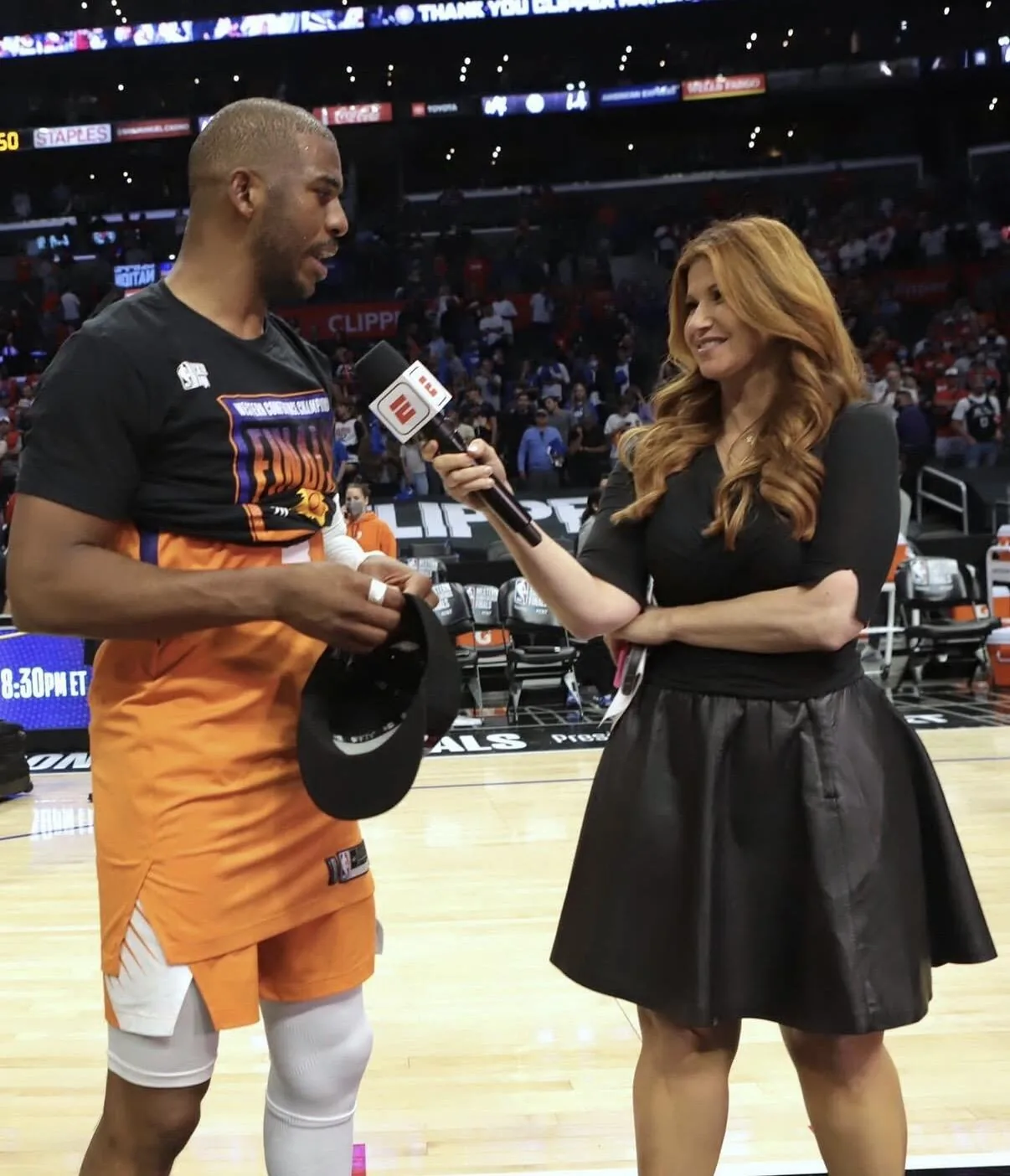 Rachel Nichols interviewing Chris Paul courtside