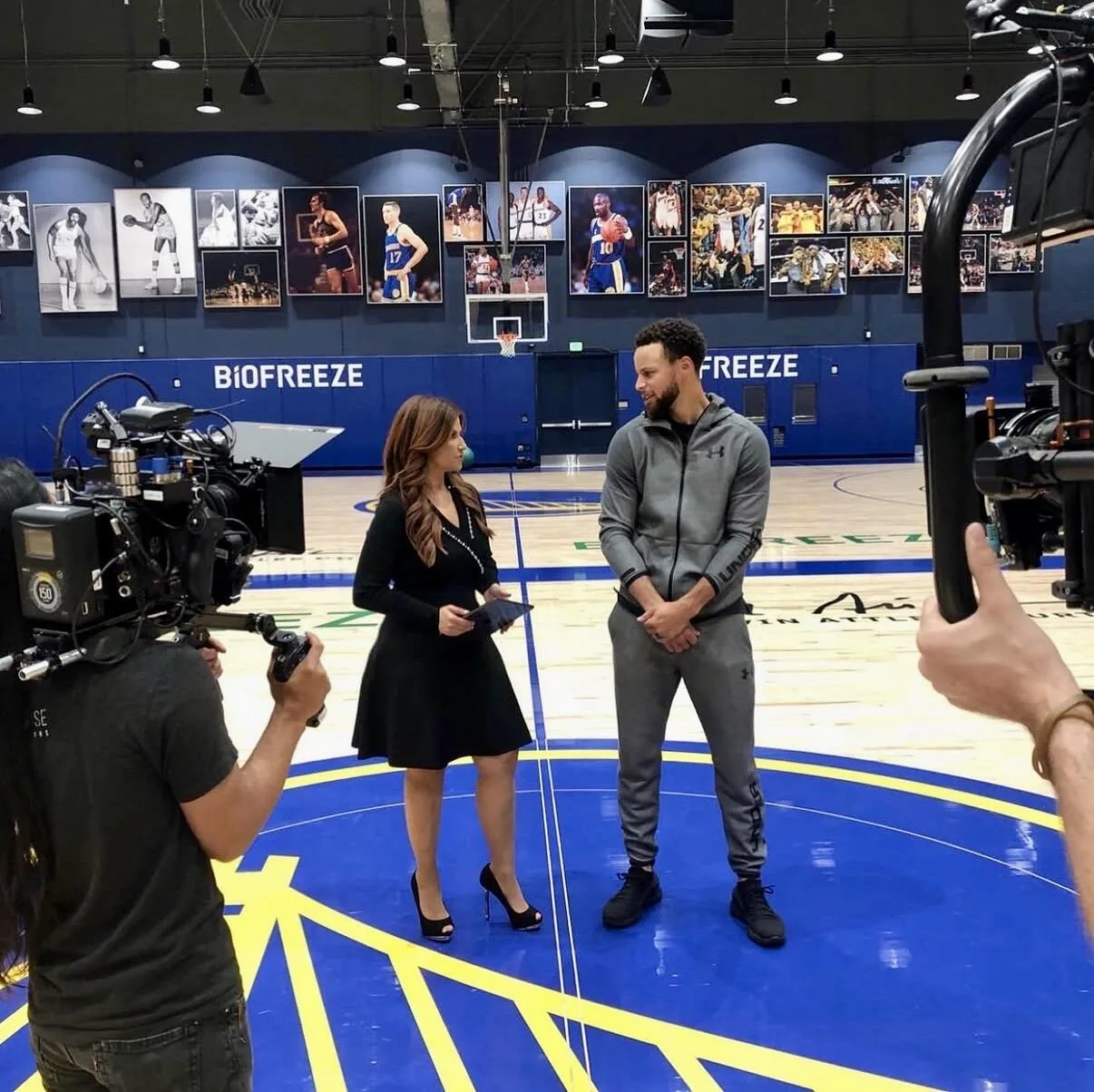 Rachel Nichols interviewing Stephen Curry on the Golden State Warriors practice court